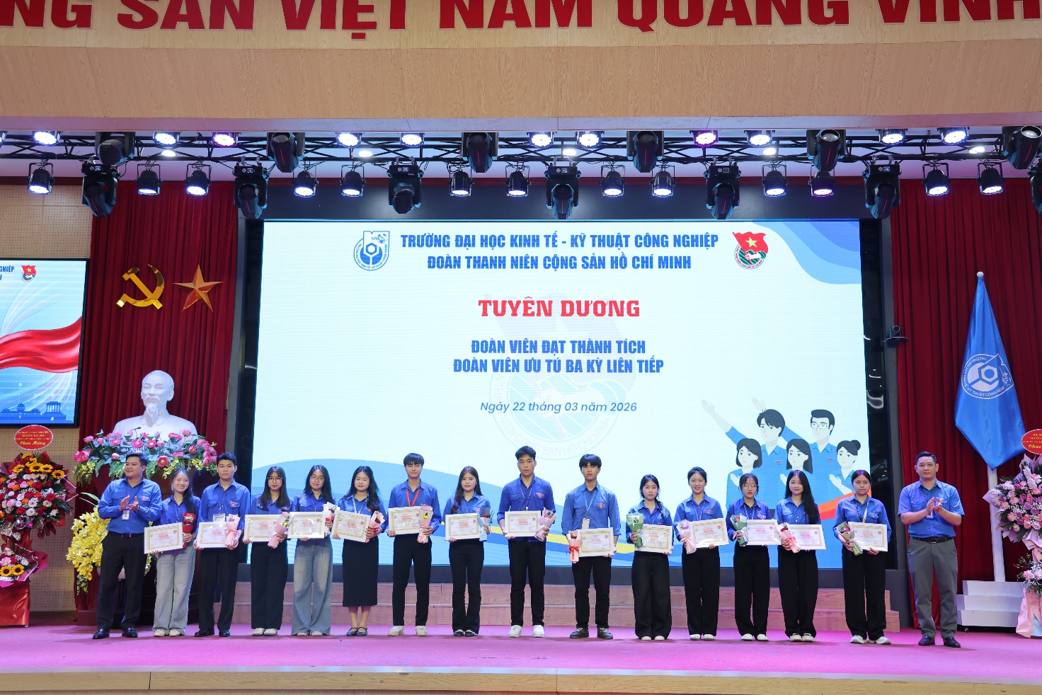 A group of people on a stage Description automatically generated