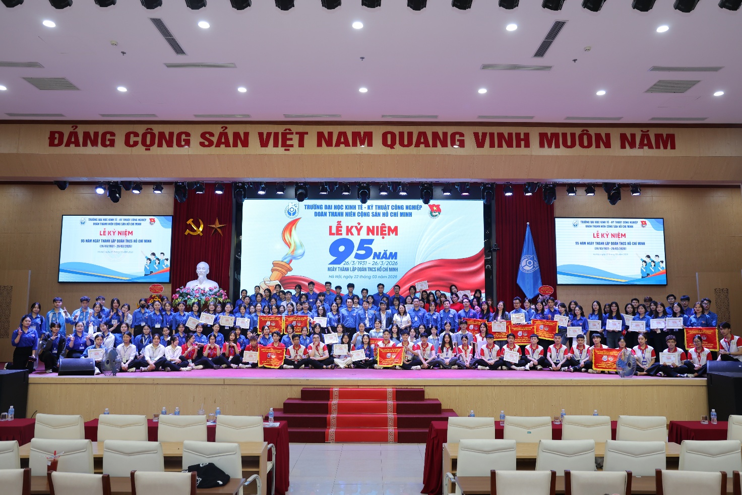 A group of people on a stage Description automatically generated
