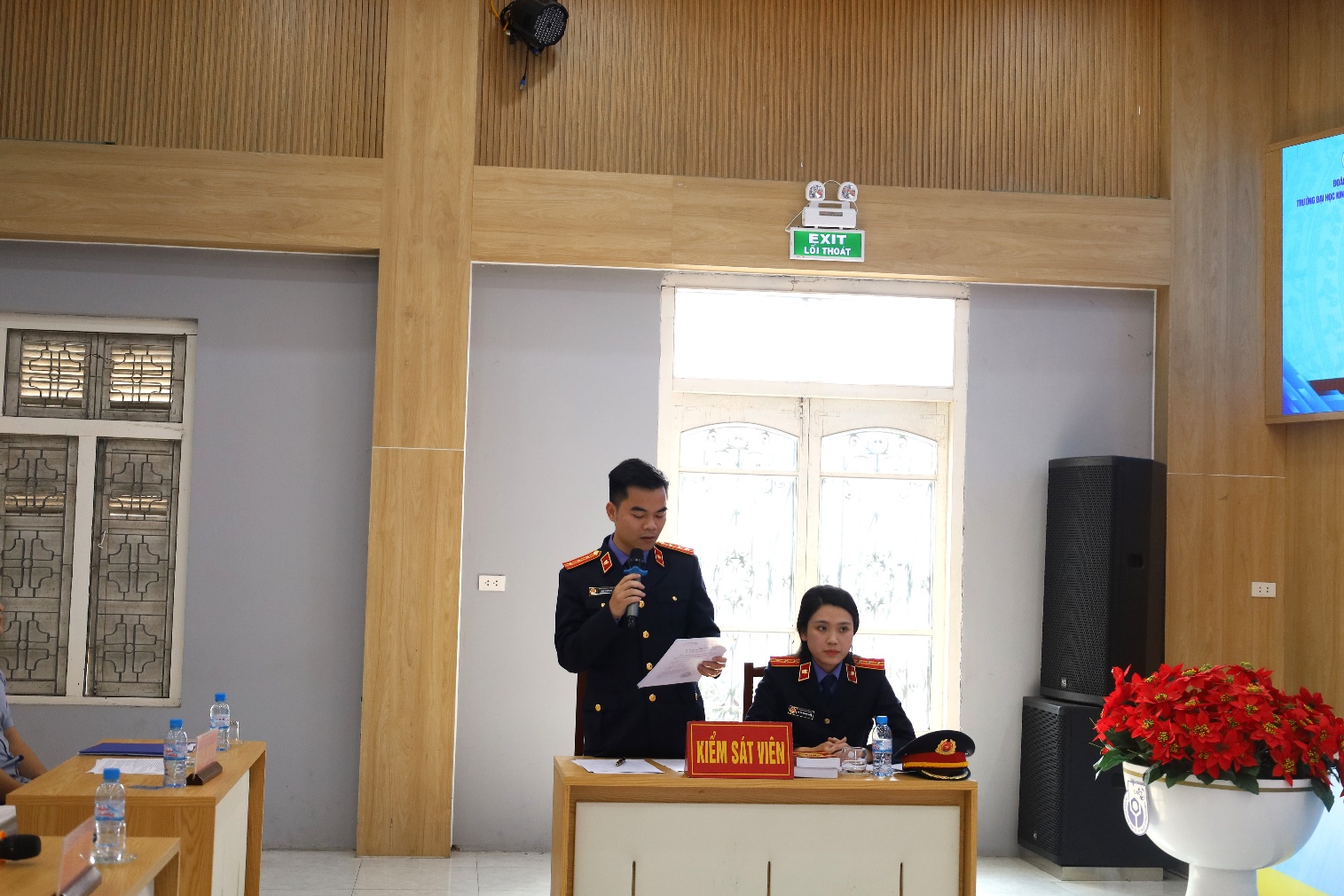 A person and person in uniform Description automatically generated