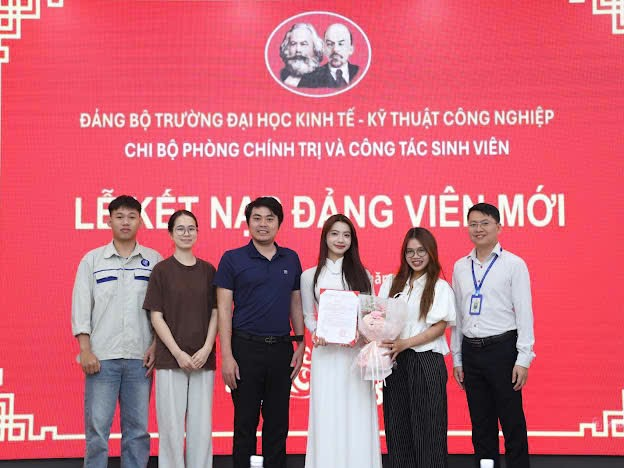 A group of people posing for a photo
Description automatically generated