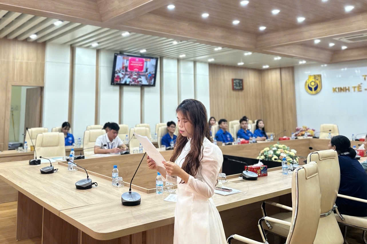 A person standing at a table
Description automatically generated