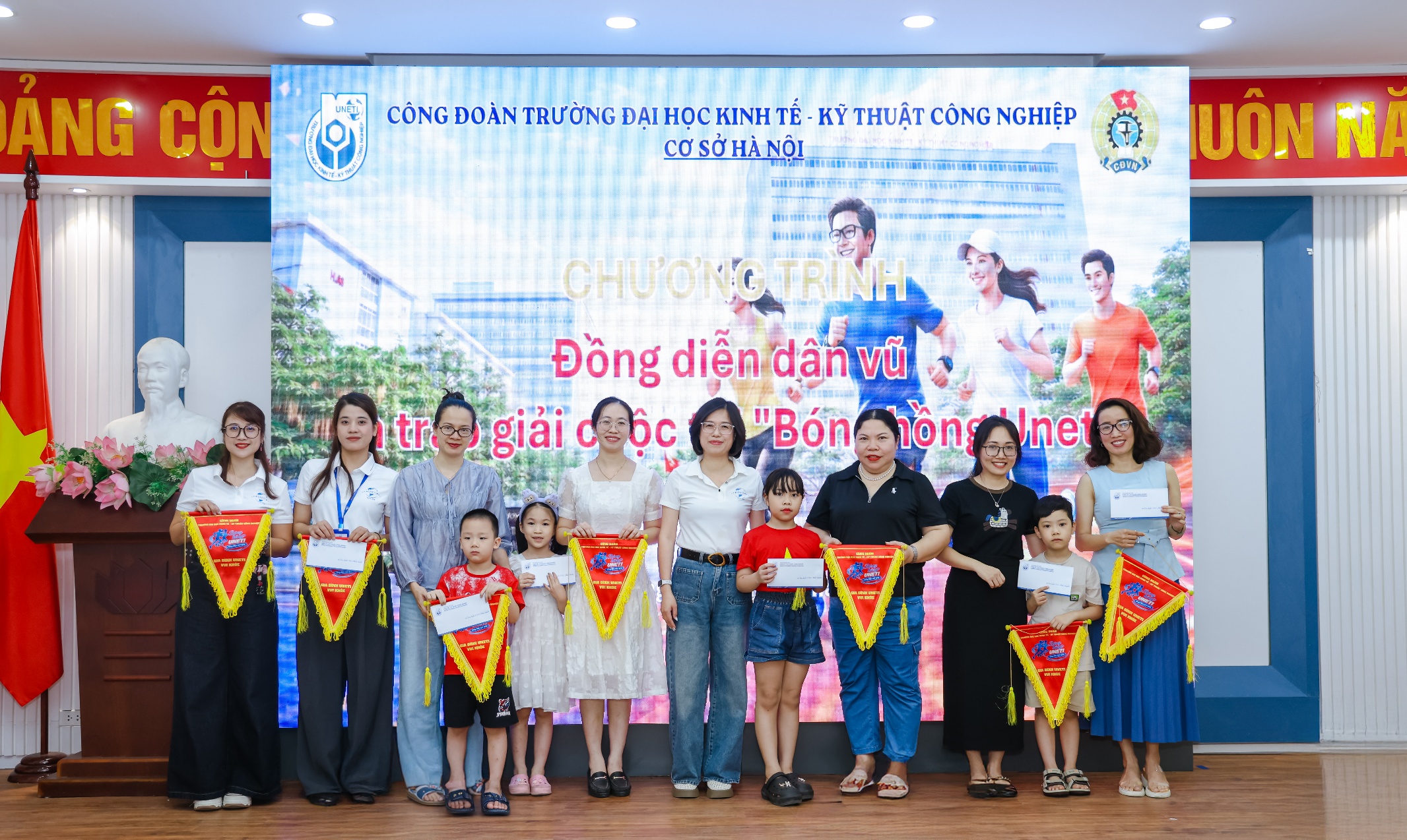 A group of people holding flags Description automatically generated