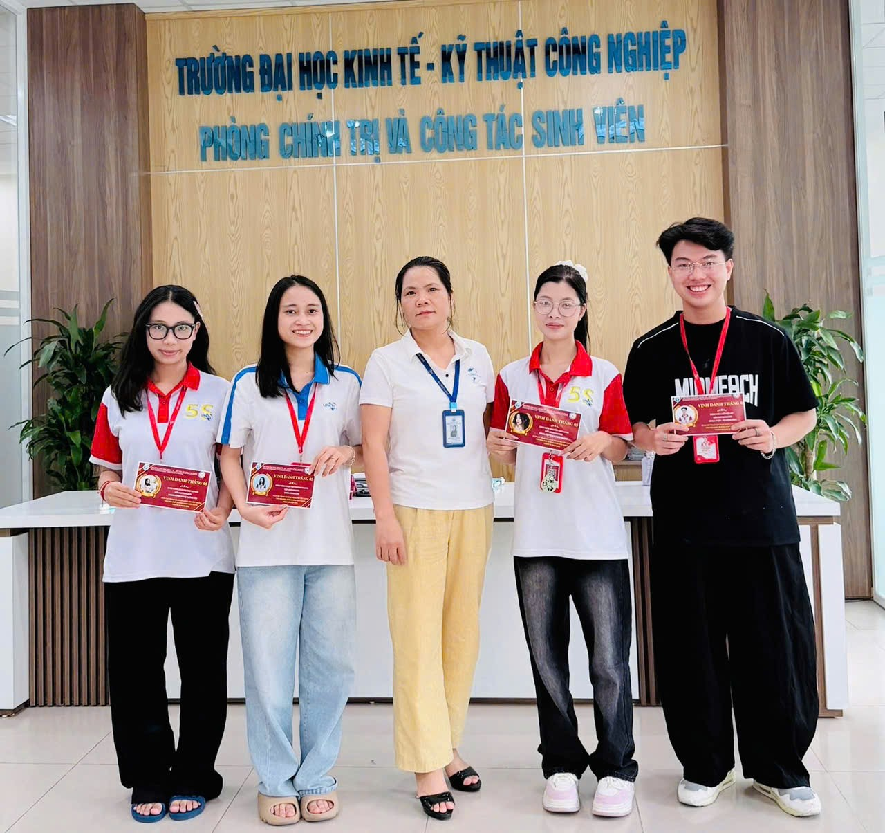 A group of people posing for a photo Description automatically generated