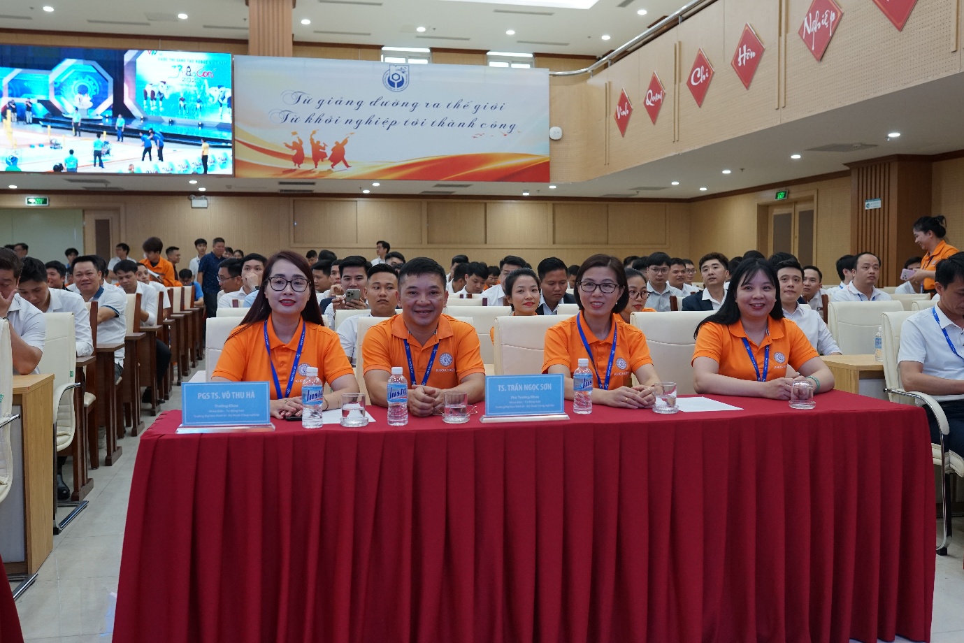 A group of people sitting at a table

Description automatically generated